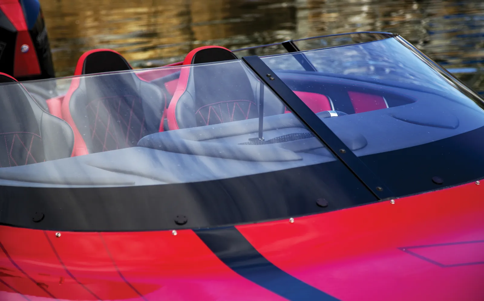 Impact resistant slant windscreen creates minimum drag while keeping eyes safe. Intelligently designed to maximize cabin acoustics