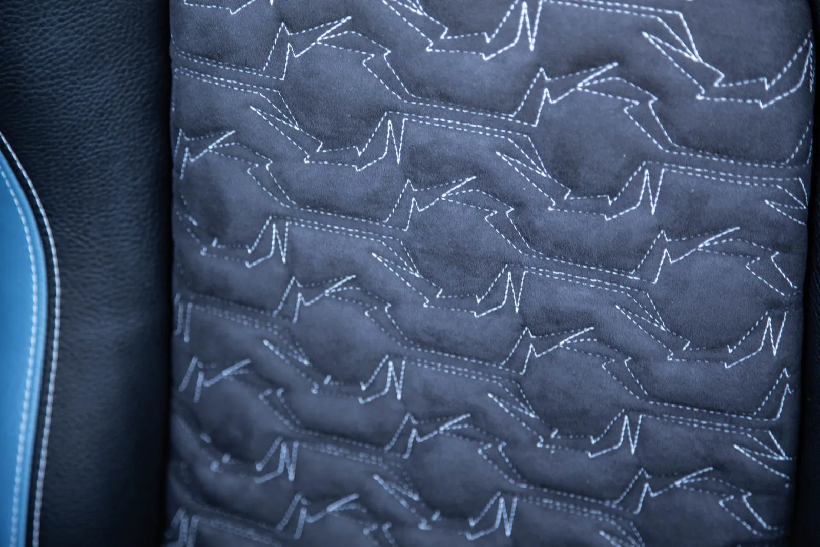 Charcoal cool touch quilted insert displayed with inlaid Fountain lightning bolt logo hand-stitched accents