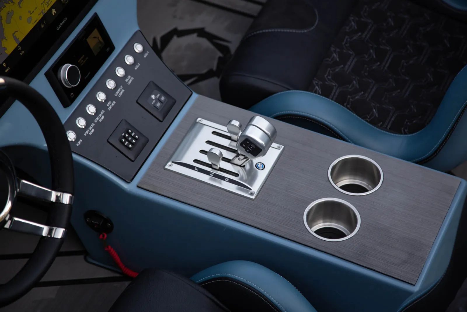 Stainless steel console cupholders with RGB adjustable accent lights perfectly complement cockpit RGB lighting for stylish and thoughtful accents throughout