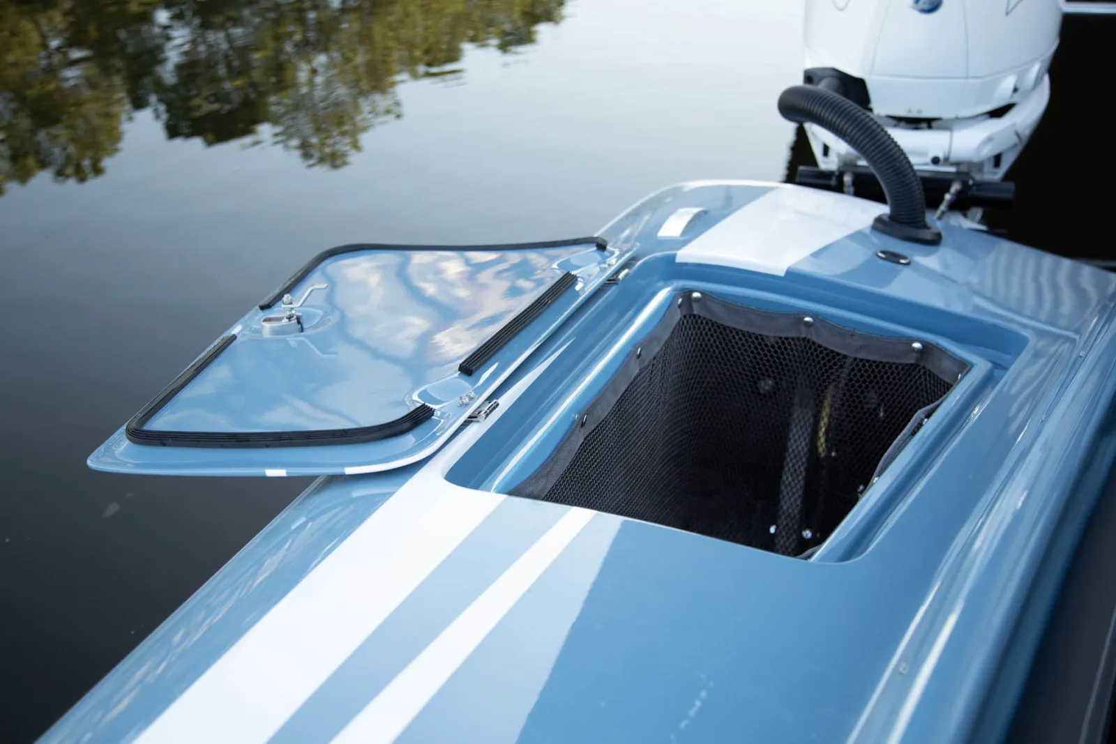Seamlessly integrated optional bow fender lockers with anti-vibration lining and locking flip-out latches keep components healthy and quiet while underway