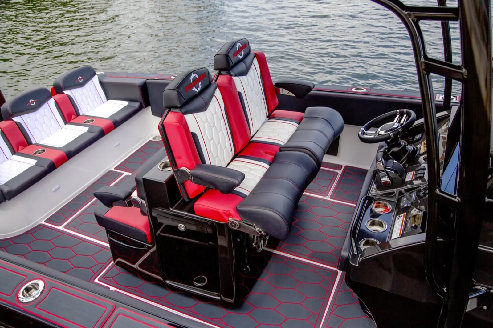 Premium dual helm seating comes standard with custom inlaid and stitched embroidery, folding arm rests, and articulating arm rests