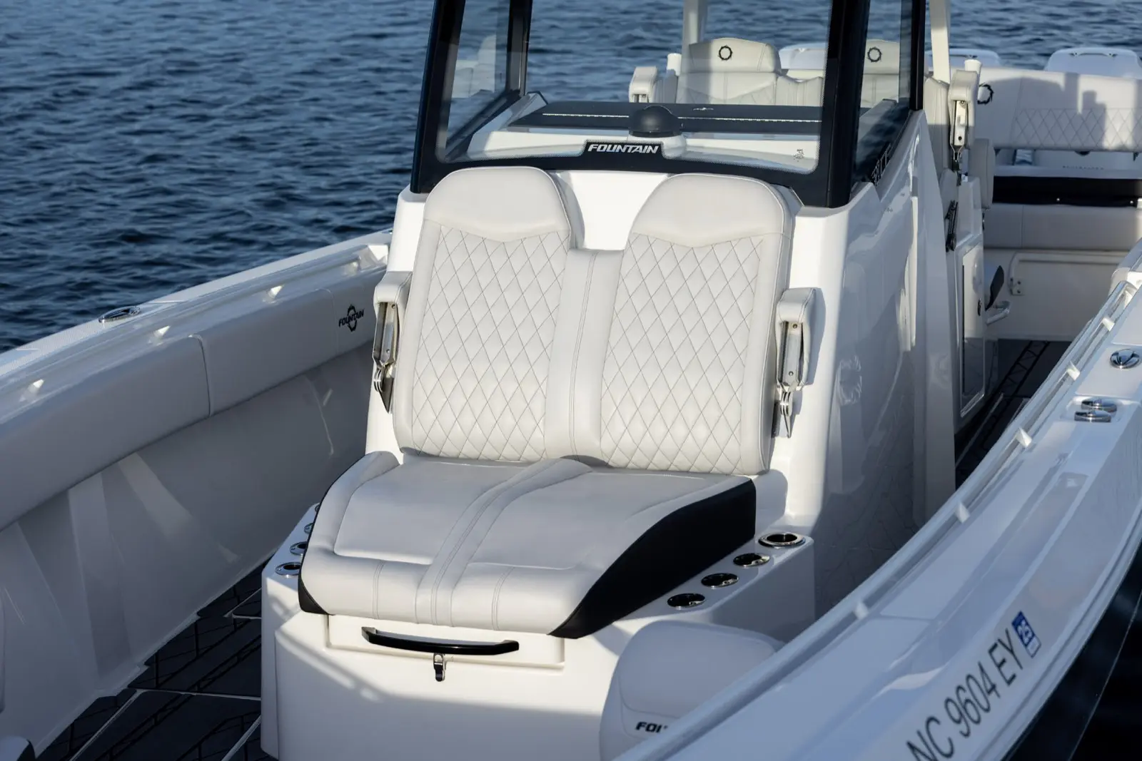 Dual forward console seat with articulating armrests features 8 surrounding rod holders and 400qts of wet or dry under seat storage