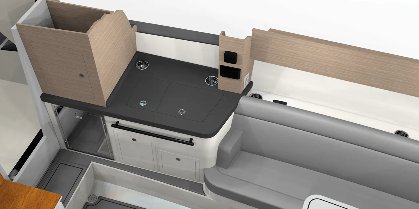 Shown is the cabin bar area in closed layout, showcasing stowable sink hardware, solid surface bar tops with cupholders, and ease of access from cabin seating