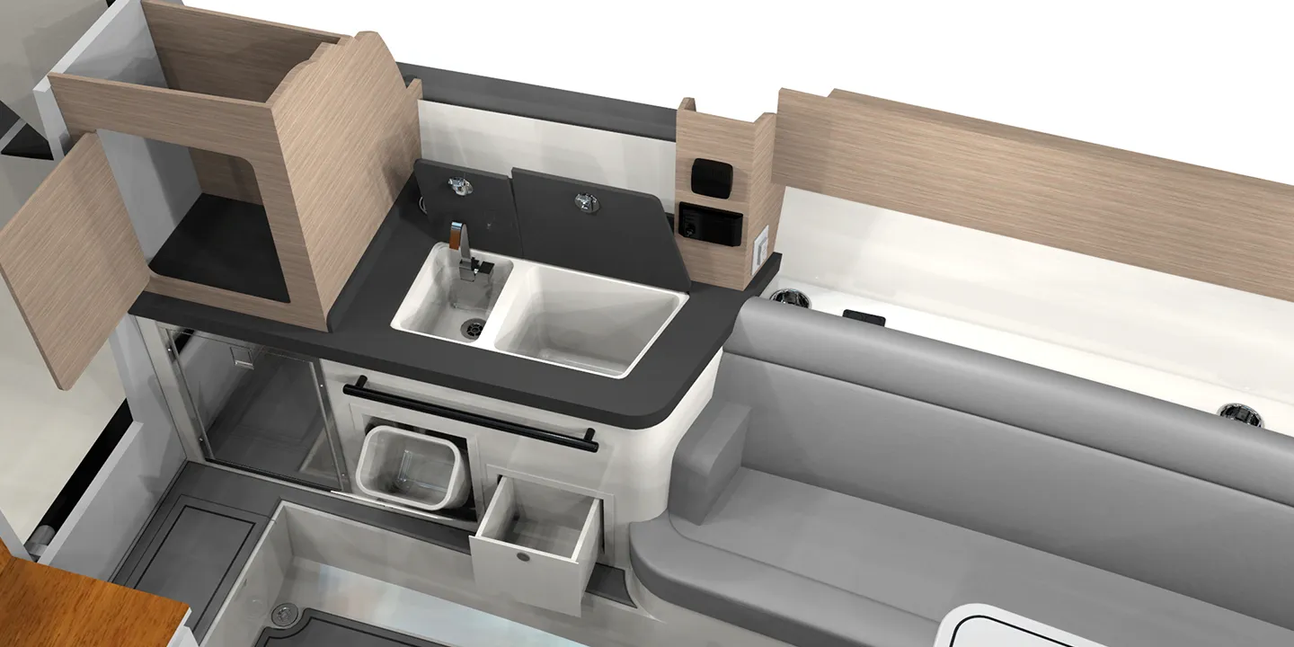 Additional features in cabin include cabin bar, trash compartments below, dual sink tubs with overboard drains, USB outlets, and optional fridge conveniences available